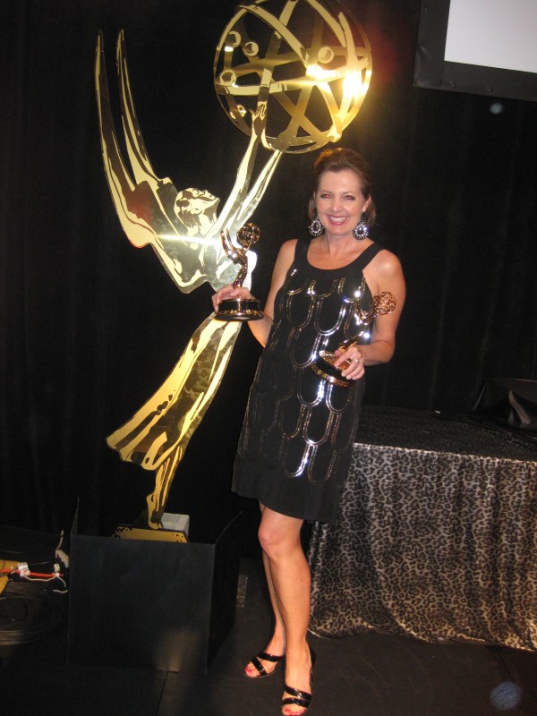 Jane Mitchell at the 2009 Emmys, posing with her awards