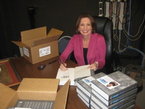 Jane Mitchell signing copies of her book