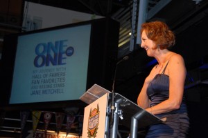 Jane Mitchell speaks from the podium at her One on One book release event.