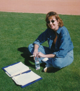 Jane Mitchell reviewing notes before going on the air
