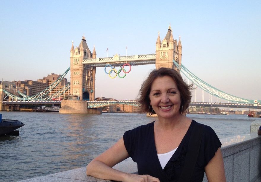 Jane stands at the edge of the Thames River with the Tower Bridge behind her during the 2012 London Summer Olympics